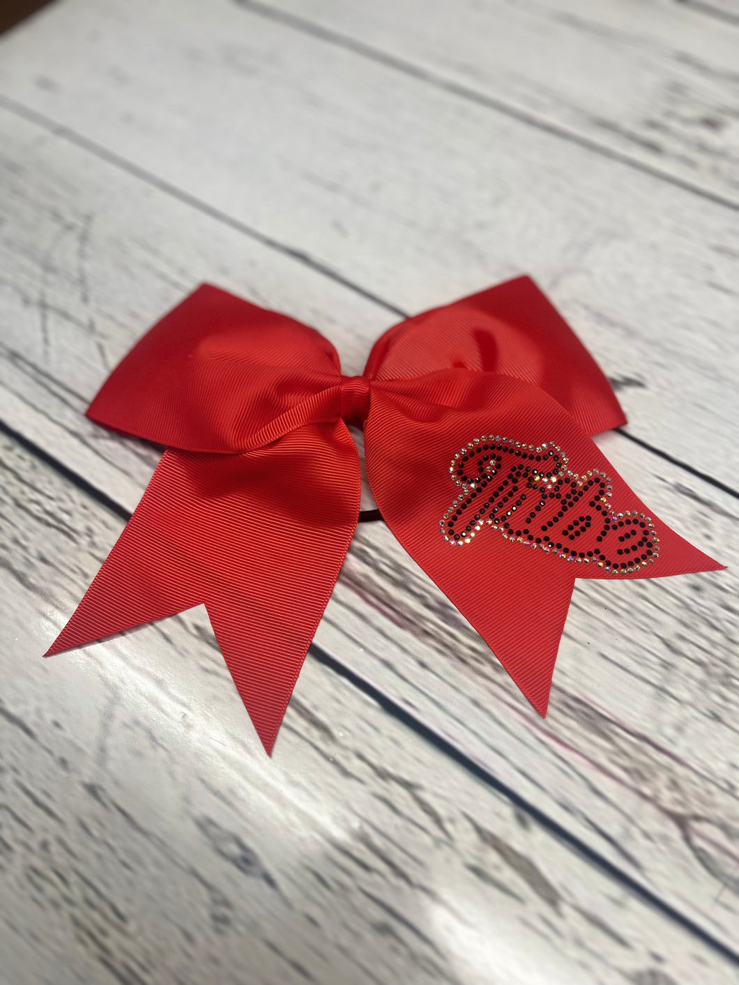 Red practice bow with rhinestones